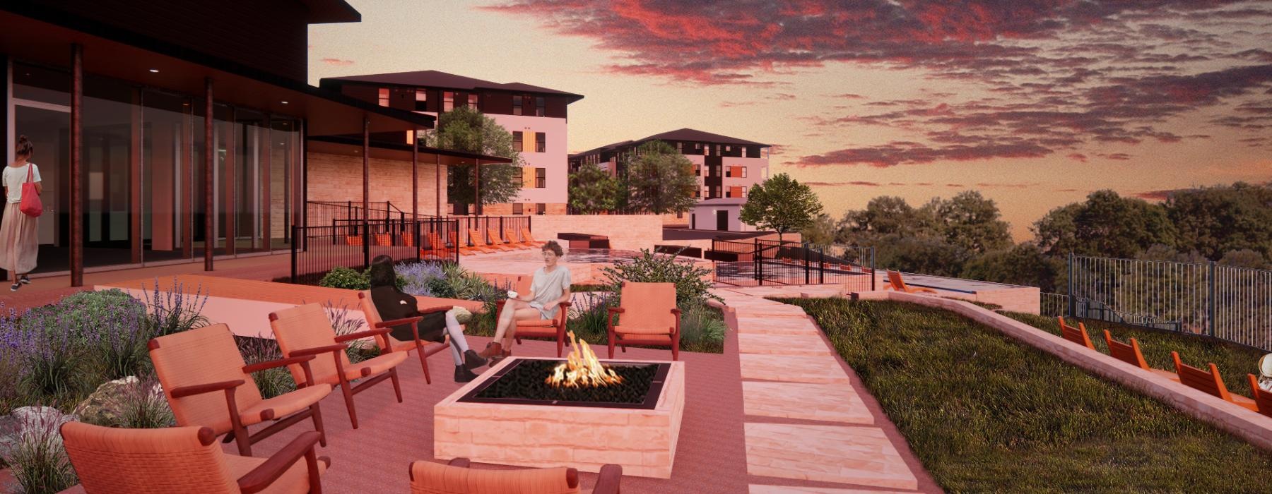 a patio with chairs and a fire pit with a fire in the distance