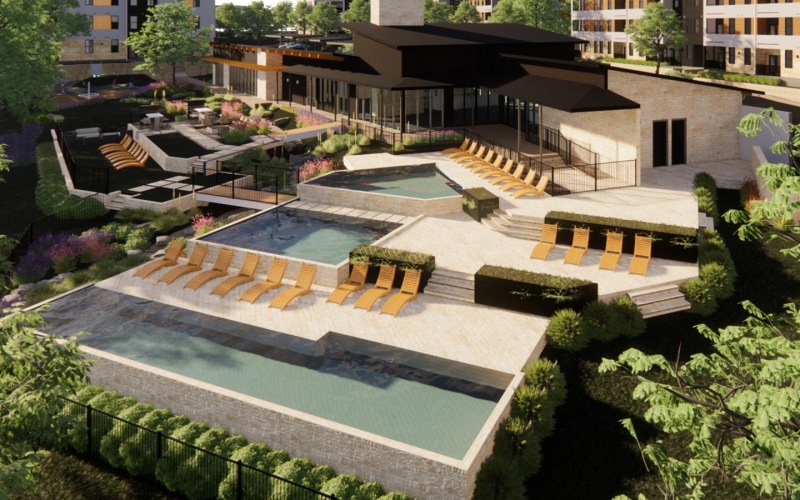 Aerial view of resort-style swimming pool at Cadena at the Falls South Austin apartments